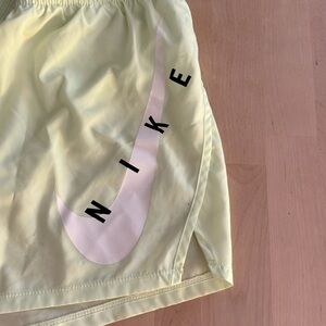 Nike neon yellow running shorts. Size M